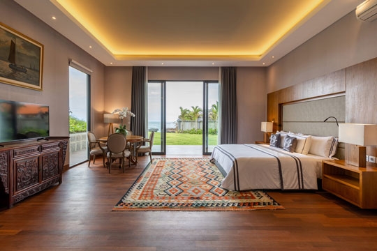 005 Tirtha Bayu Villa I   Deluxe Suite with seating area and garden access